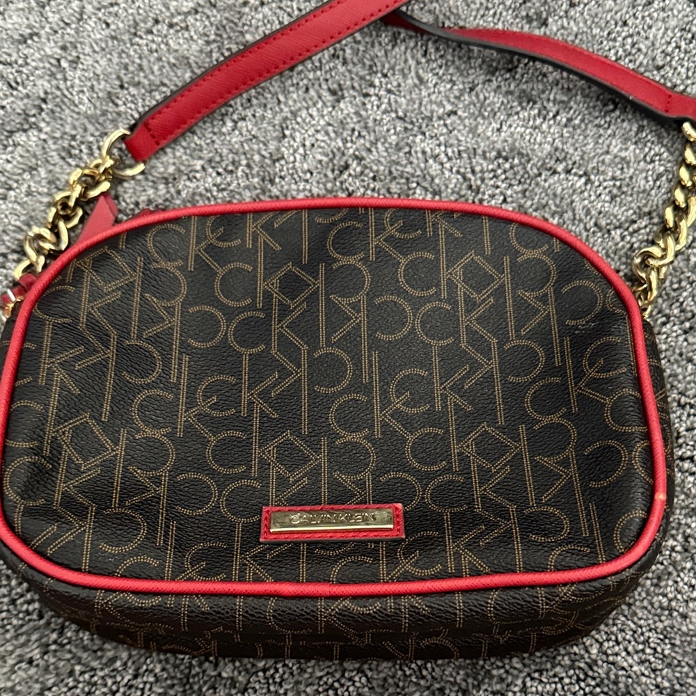 Calvin Klein Monogram Crossbody Bag in Brown and Red